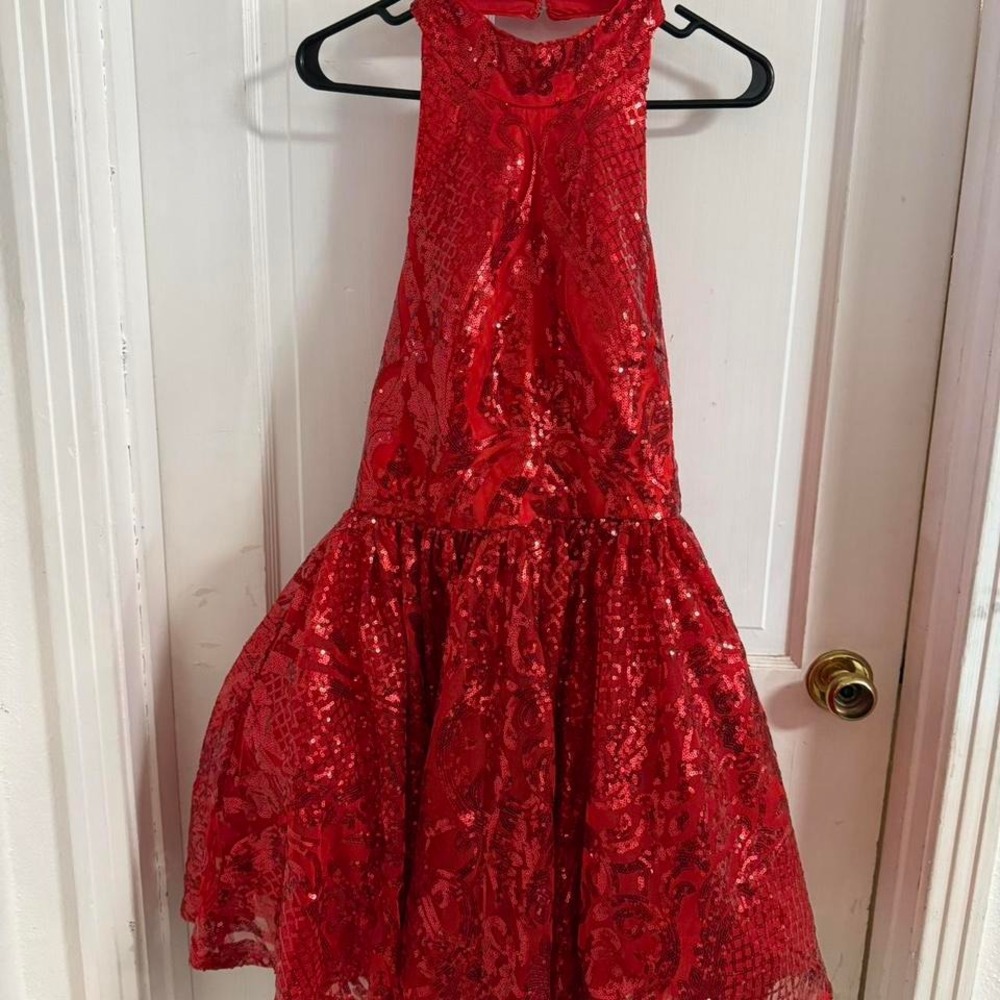 Red sequin halter top dress. Has cups made inside bodice. Size 10
